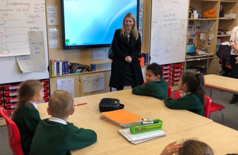 Julia stood at the front of a classroom on a visit to Scotts.