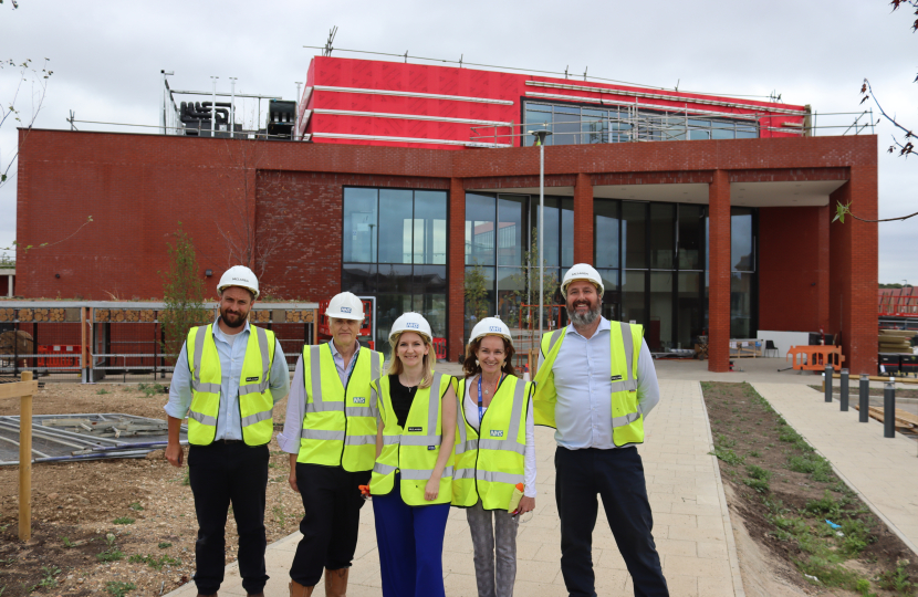 Julia at St. George's NHS Hub a month ahead of it's opening with others involved in the construction project.