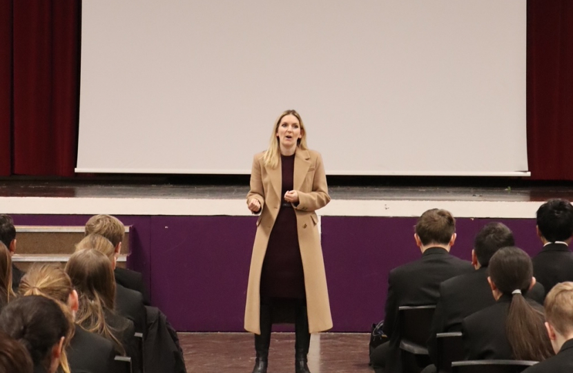 Julia Lopez MP addressing pupils at Sanders Draper Academy