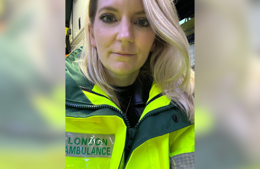 A selfie of Julia in high-vis on the ambulance.