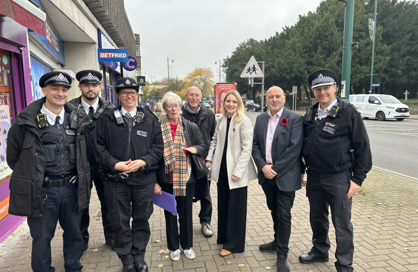 Julia, Keith Prince AM, community activists and the police smiling for a photo together on Upminster High Street