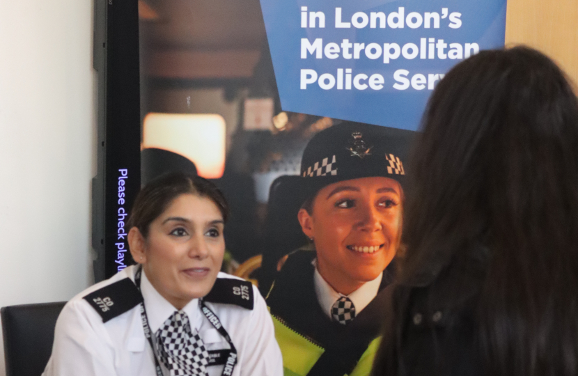 Attendees speaking with the Police about job opportunities