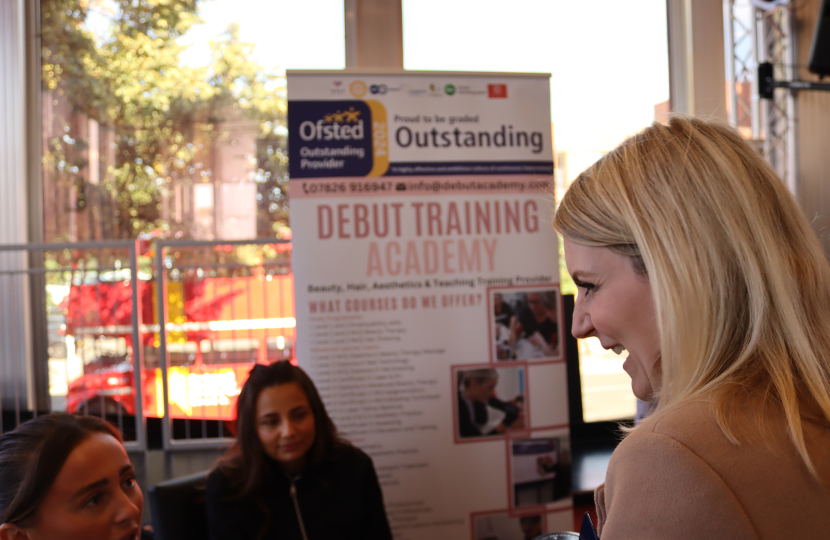 Julia Lopez MP talking with employers at the Jobs, Skills and Apprenticeship Fair