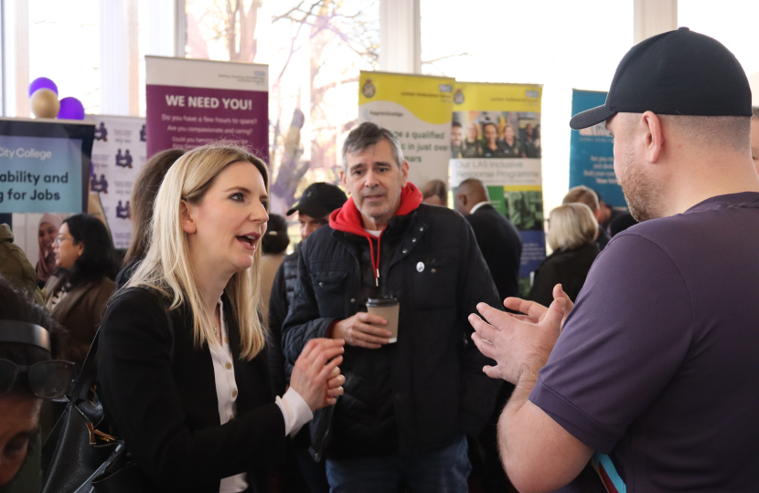 Julia chatting to a men's talking charity at the Jobs Fair