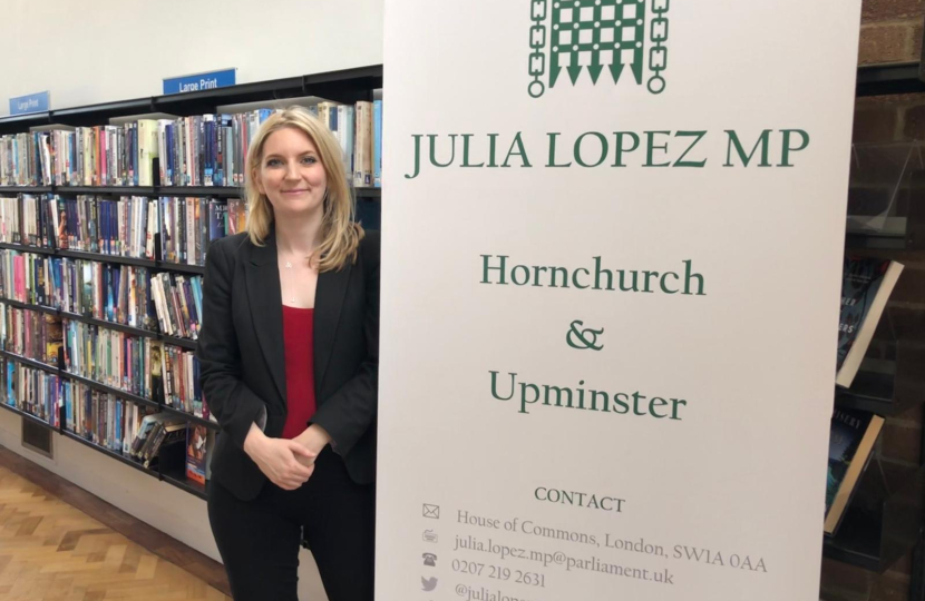 Julia Lopez with a pop up banner following a surgery at Harold Wood Library.