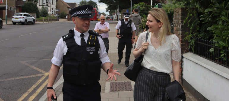 Julia with an officer during a walkabout.