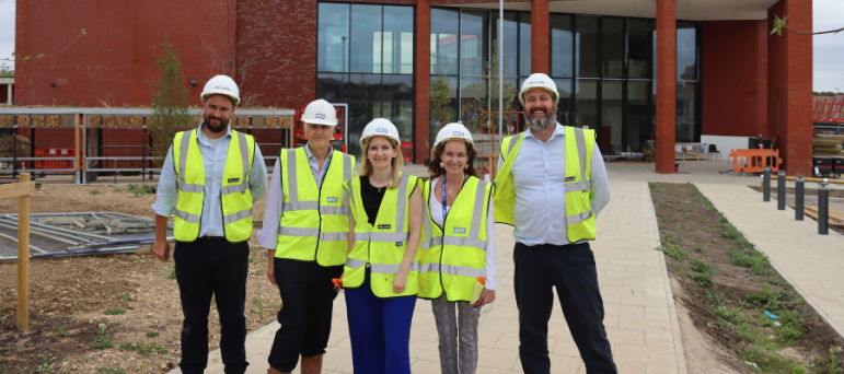 Julia with people from the NHS ahead of the opening of the St. George's NHS Hub.