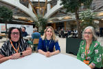 Julia Lopez with two of the debt coaches at a table in Portcullis House