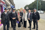 Julia, Keith Prince AM, community activists and the police smiling for a photo together on Upminster High Street