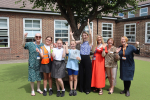 Julia with staff and pupils at Branfil Primary as they receive their OPAL Award.