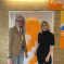 Photo of Julia and Grazina in front of an orange balloon to celebrate 40 years of the hospice during Julia's visit.