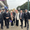 Julia, Keith Prince AM, community activists and the police smiling for a photo together on Upminster High Street