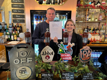 Julia Lopez MP presents Greg Mangham with his Points of Light Award at The Windmill Pub, Upminster