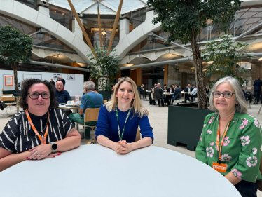 Julia Lopez with two of the debt coaches at a table in Portcullis House