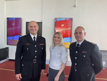 Julia Lopez with Fire Officers at the Older People's Fair at Queen's Theatre Hornchurch