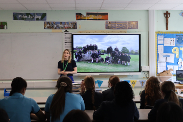 Julia addressing pupils at Sacred Heart of Mary Girls' School